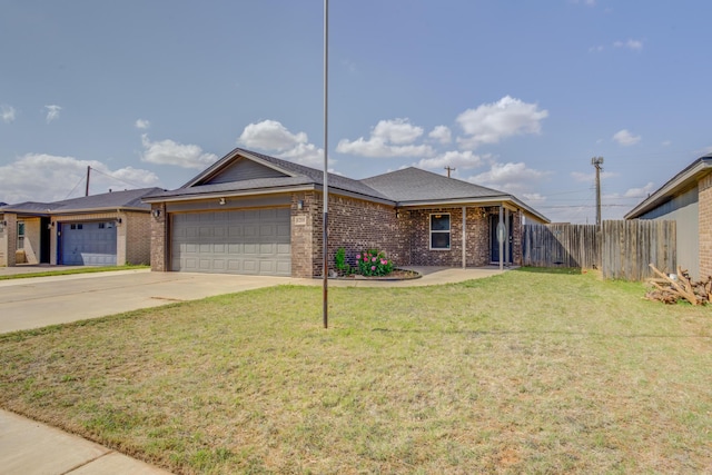 6208 21st St, Lubbock, TX 79407 - single story home featuring fence, brick siding, concrete driveway, a garage, and a front lawn