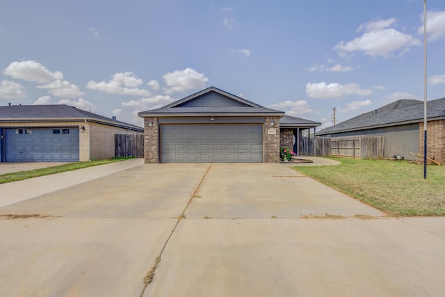 6208 21st St, Lubbock, TX 79407 - single story home with a garage, brick siding, fence, and a front yard