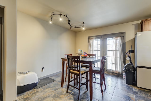 6208 21st St, Lubbock, TX 79407 - dining space featuring french doors and baseboards