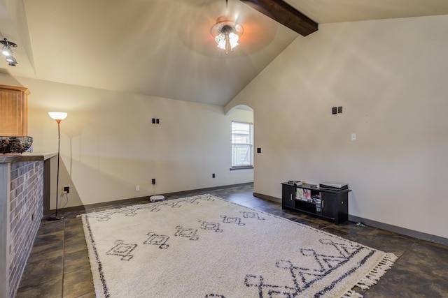 6208 21st St, Lubbock, TX 79407 - unfurnished living room featuring a ceiling fan, baseboards, lofted ceiling with beams, and arched walkways