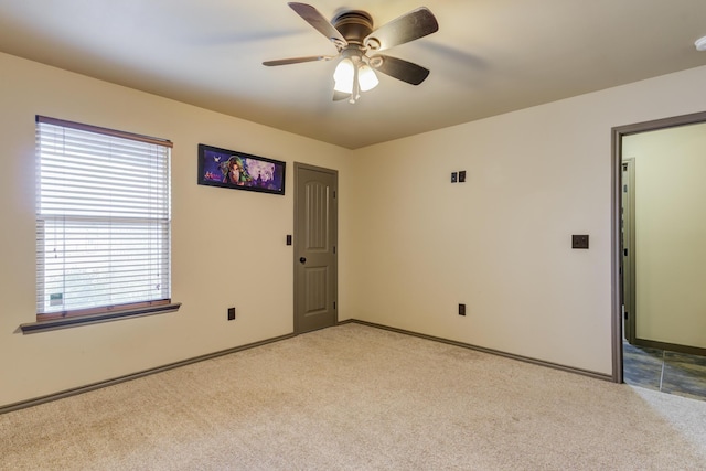 6208 21st St, Lubbock, TX 79407 - empty room with a ceiling fan, light carpet, and baseboards