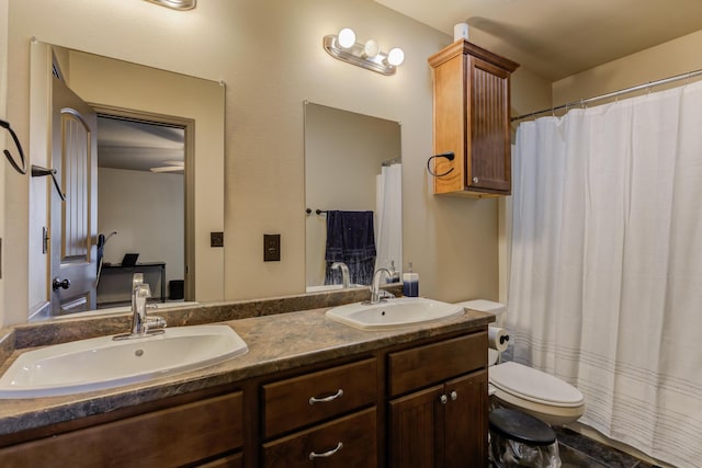 6208 21st St, Lubbock, TX 79407 - bathroom with toilet, double vanity, and a sink