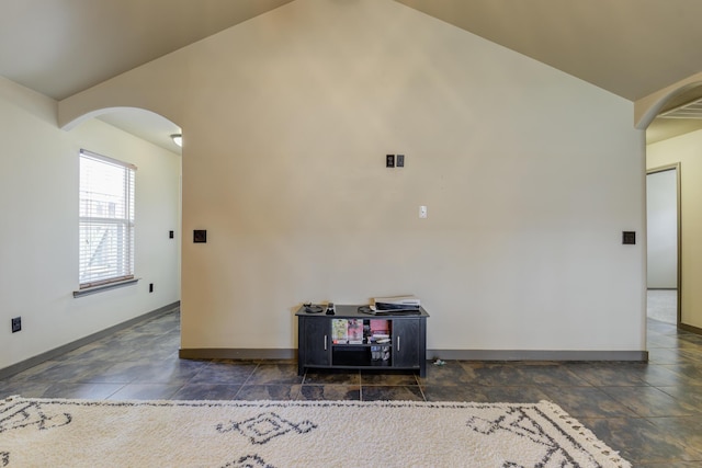 6208 21st St, Lubbock, TX 79407 - unfurnished room with lofted ceiling, arched walkways, baseboards, and visible vents