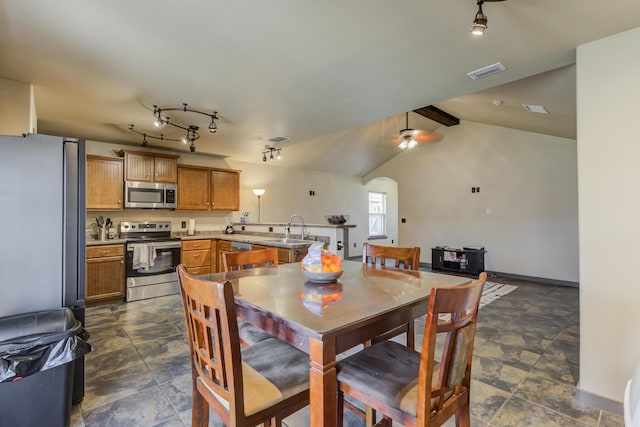 6208 21st St, Lubbock, TX 79407 - dining area featuring arched walkways, ceiling fan, lofted ceiling, and visible vents