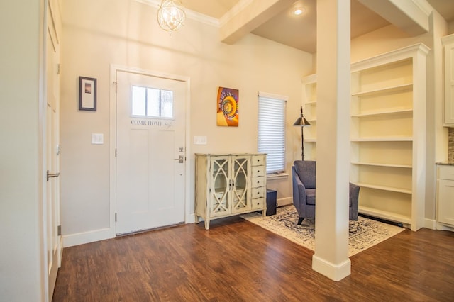 foyer entrance featuring beam ceiling and dark wood-type flooring