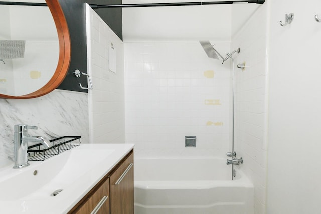 bathroom featuring vanity and tiled shower / bath combo