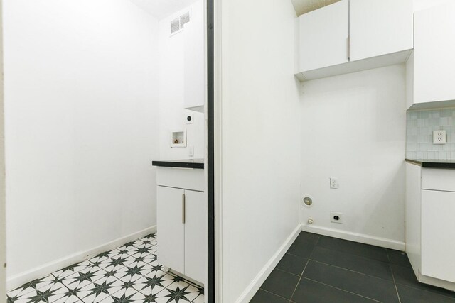 laundry room with washer hookup, cabinets, and hookup for an electric dryer