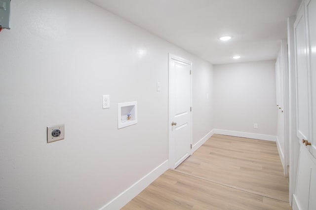 laundry area featuring washer hookup, hookup for an electric dryer, and light wood-type flooring