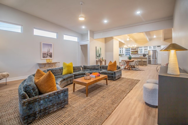 living room with beam ceiling and wood-type flooring