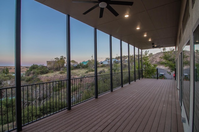 deck at dusk with ceiling fan