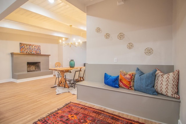 interior space featuring a chandelier, hardwood / wood-style floors, and beam ceiling