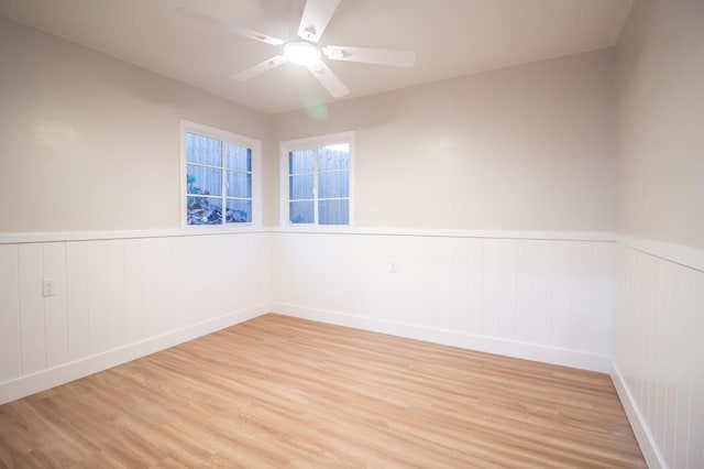 spare room with ceiling fan and light hardwood / wood-style floors