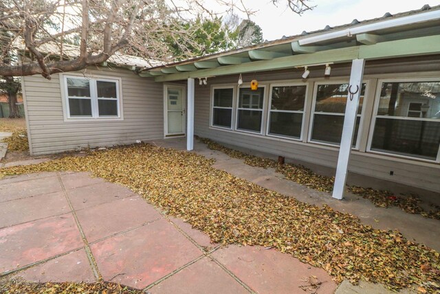 doorway to property featuring a patio