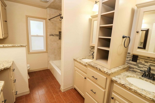 full bathroom featuring vanity, backsplash, hardwood / wood-style flooring, and toilet