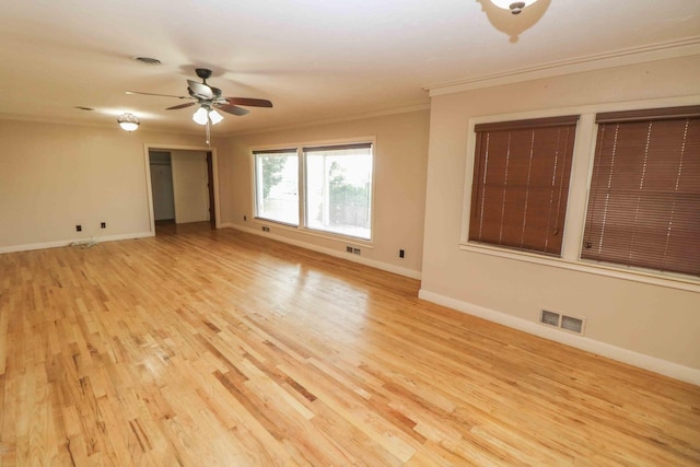 unfurnished room with crown molding, ceiling fan, and light wood-type flooring