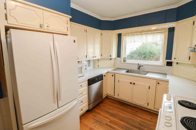 kitchen with ornamental molding, dark hardwood / wood-style floors, sink, and white appliances