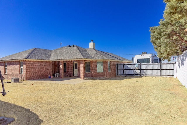 rear view of property featuring a patio