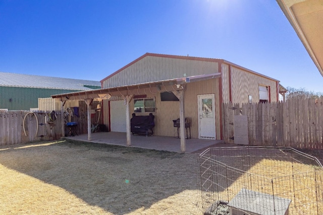 back of property featuring a patio