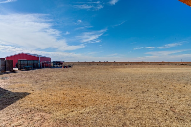 view of yard with a rural view