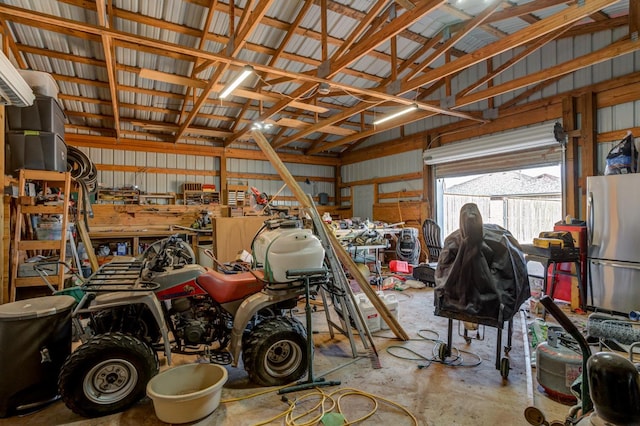 garage featuring stainless steel fridge