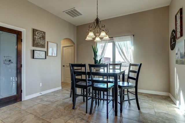 dining area with a chandelier