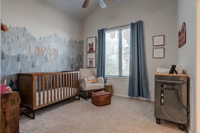 bedroom with vaulted ceiling, a nursery area, light carpet, and ceiling fan