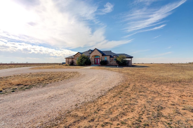 ranch-style house featuring a rural view