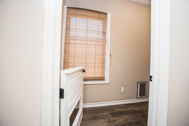 bathroom with baseboards and wood finished floors