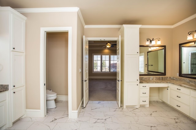 bathroom with ceiling fan, vanity, baseboards, marble finish floor, and crown molding