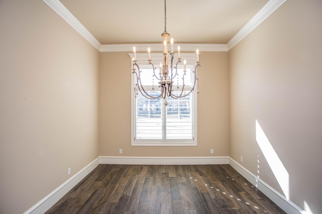 spare room with ornamental molding, a chandelier, dark wood-type flooring, and baseboards