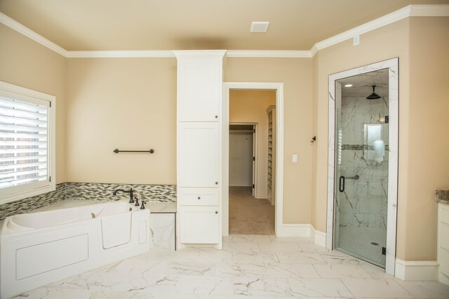 full bathroom featuring ornamental molding, marble finish floor, a marble finish shower, and a bath