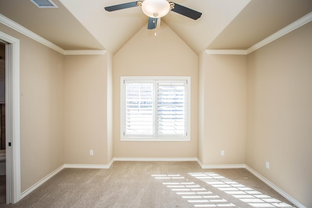 spare room with visible vents, baseboards, a ceiling fan, light colored carpet, and lofted ceiling