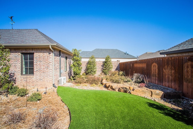 view of yard featuring a fenced backyard