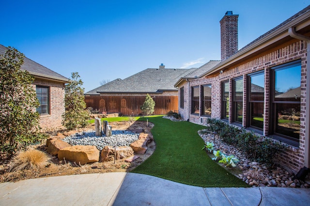 view of yard featuring fence