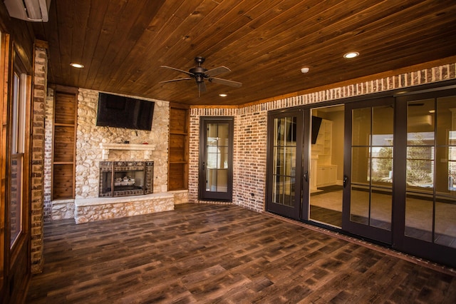 view of patio featuring ceiling fan and an outdoor stone fireplace