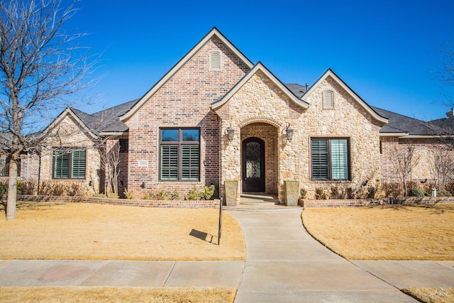 view of front of home with brick siding