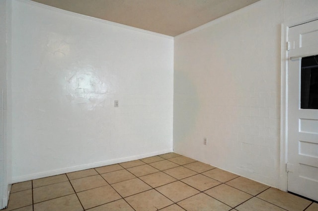 tiled empty room with ornamental molding