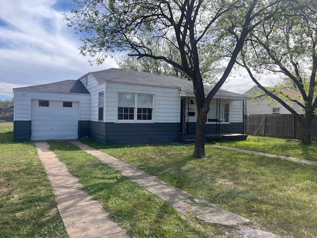 view of front facade featuring a garage and a front lawn