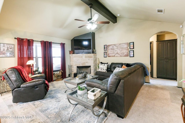10018 Ave X, Lubbock, TX 79423 - living area featuring arched walkways, ceiling fan, a fireplace, and light carpet