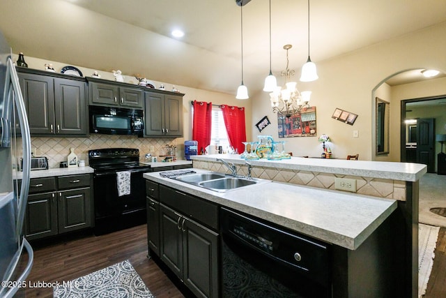10018 Ave X, Lubbock, TX 79423 - kitchen with black appliances, a sink, light countertops, and backsplash