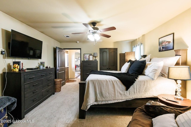 10018 Ave X, Lubbock, TX 79423 - bedroom with light colored carpet and a ceiling fan
