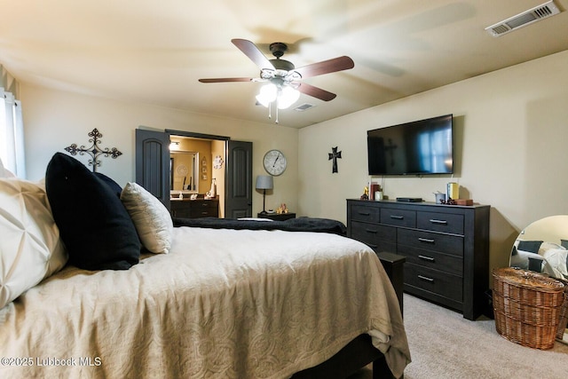 10018 Ave X, Lubbock, TX 79423 - bedroom with light carpet, a ceiling fan, and ensuite bath