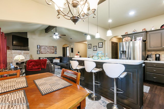 10018 Ave X, Lubbock, TX 79423 - dining area with arched walkways, ceiling fan, a chandelier, dark wood-style flooring, and recessed lighting