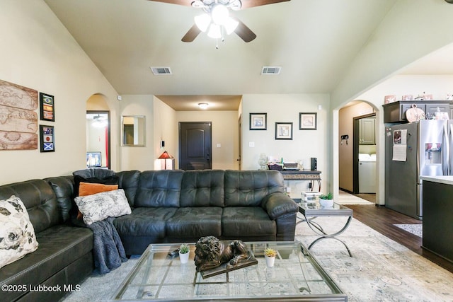 10018 Ave X, Lubbock, TX 79423 - living room featuring lofted ceiling, arched walkways, a ceiling fan, and dark wood-style flooring
