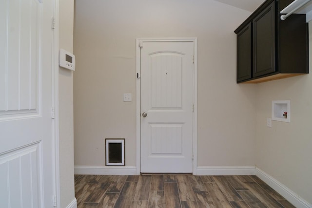 laundry area featuring cabinets, dark hardwood / wood-style floors, and hookup for a washing machine