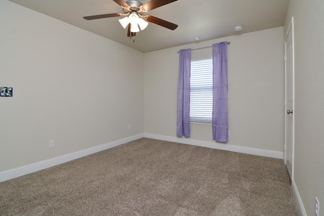 empty room with carpet flooring and ceiling fan