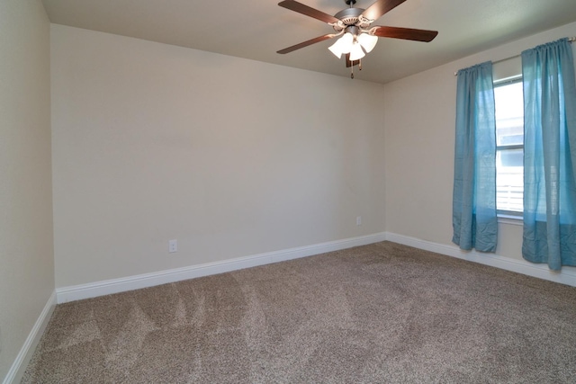 spare room with ceiling fan and carpet flooring