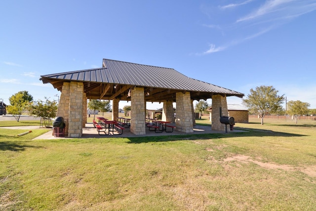 view of property's community featuring a gazebo, a yard, and a patio