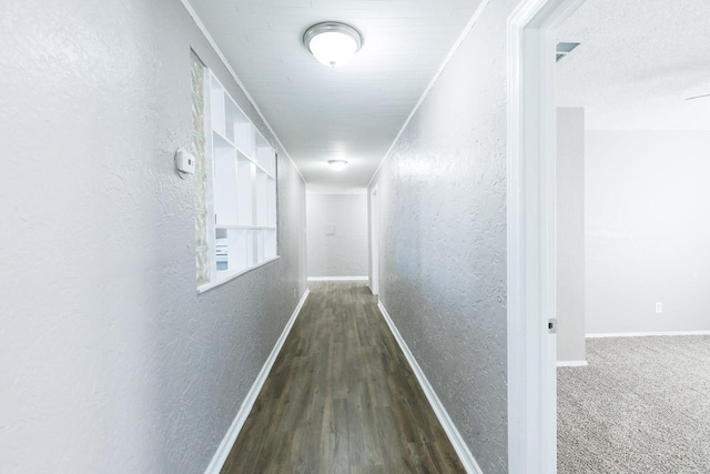 hall featuring dark hardwood / wood-style flooring and ornamental molding