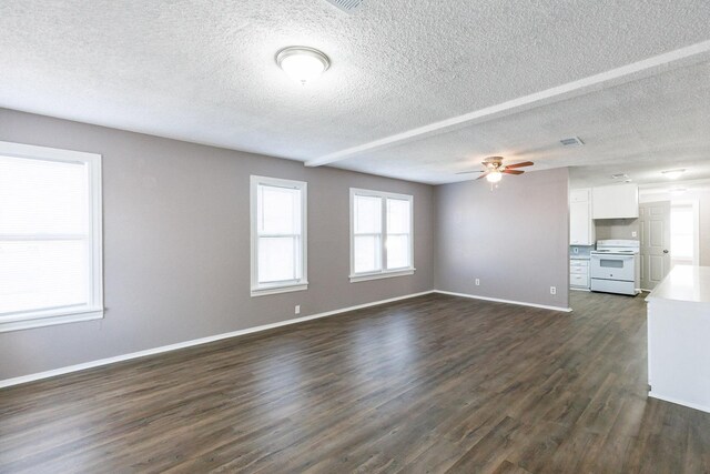 unfurnished living room featuring dark hardwood / wood-style flooring, a textured ceiling, and ceiling fan